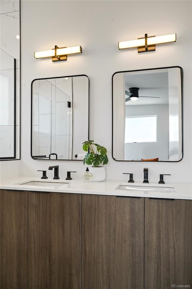 bathroom with ceiling fan and vanity