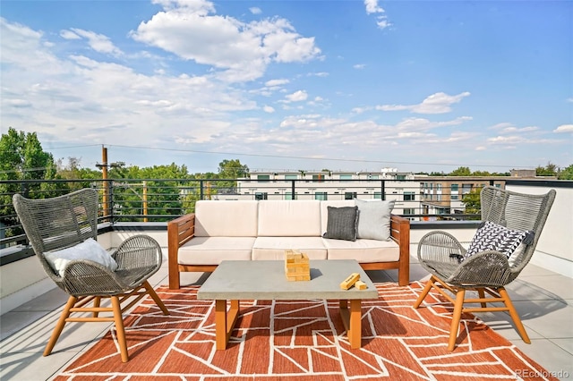 view of patio with a balcony and outdoor lounge area