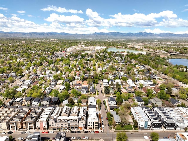 drone / aerial view with a water and mountain view