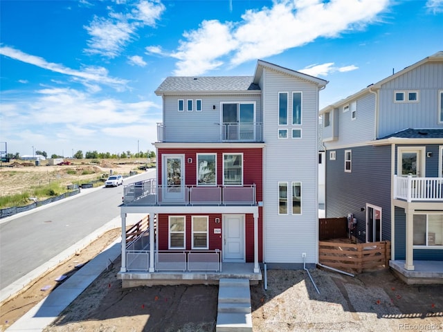 13616 E 103rd Pl, Commerce City, CO 80022 - view of front of house with a balcony and a porch