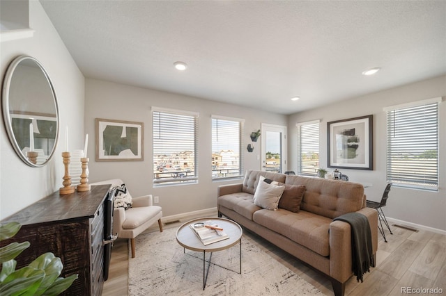 13616 E 103rd Pl, Commerce City, CO 80022 - living area with light wood-style floors and recessed lighting