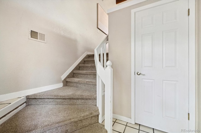 stairs featuring baseboards