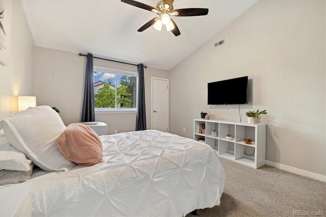 carpeted bedroom with lofted ceiling, baseboards, and a ceiling fan