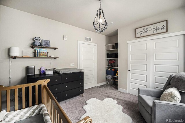 15274 W 64th Ln Unit 206, Arvada, CO 80007 - bedroom featuring visible vents, carpet, baseboards, and a closet