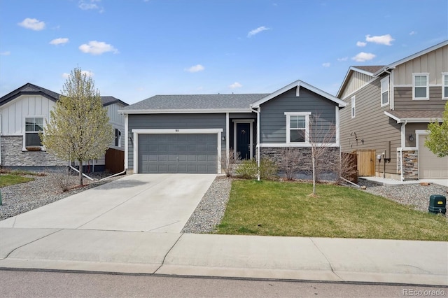 95 S Edge Cliff St, Castle Rock, CO 80104 - view of front of home with board and batten siding, an attached garage, a front yard, and driveway