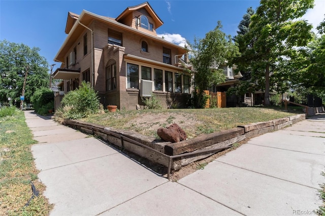 view of front of property with a sunroom