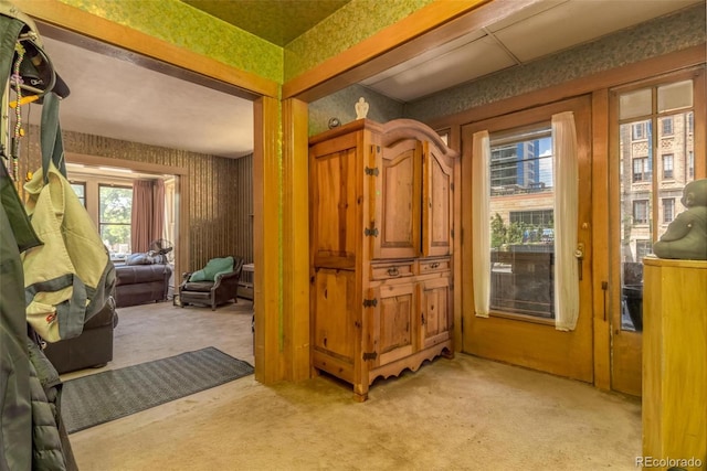 interior space featuring light colored carpet