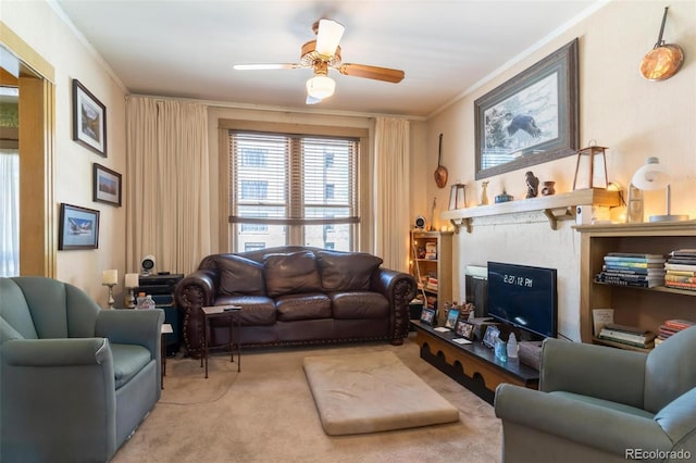 living room with ceiling fan, crown molding, and light colored carpet