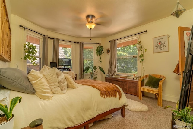 bedroom with ceiling fan and light colored carpet