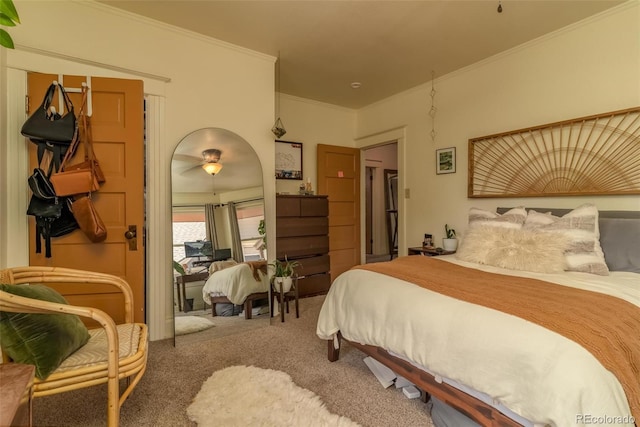 carpeted bedroom featuring crown molding