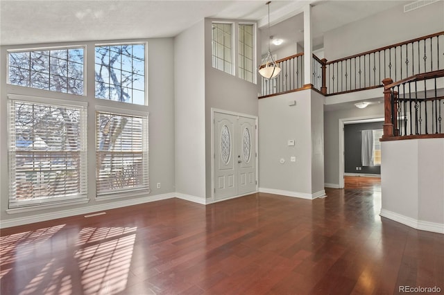 entrance foyer with dark hardwood / wood-style flooring