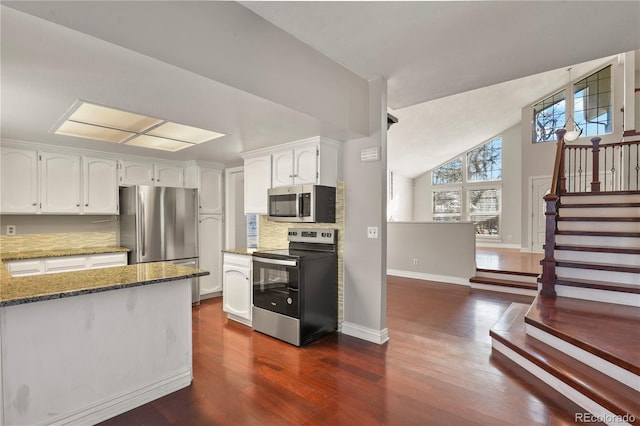 kitchen featuring white cabinetry, tasteful backsplash, dark hardwood / wood-style floors, stone counters, and stainless steel appliances