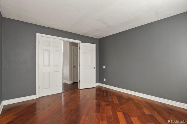 unfurnished bedroom with wood-type flooring