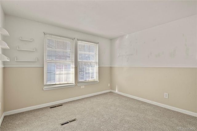 unfurnished room with carpet flooring