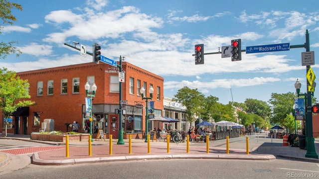 8404 W 52nd Ave, Arvada, CO 80002 - view of asphalt street with traffic lights, curbs, sidewalks, street lighting, and traffic signs