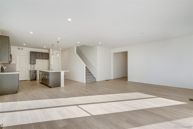 interior space featuring light wood-type flooring and sink