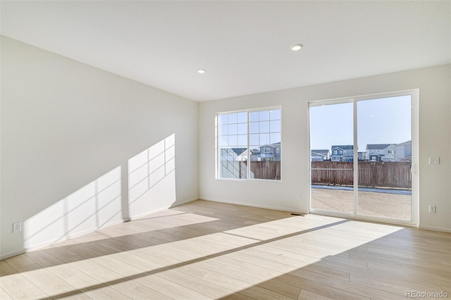 unfurnished room featuring light hardwood / wood-style flooring