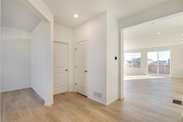 hallway with light wood-type flooring