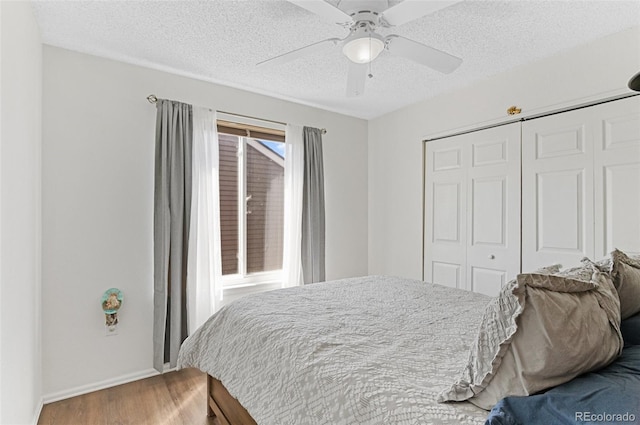 944 E Lily Ct, Highlands Ranch, CO 80126 - bedroom with wood finished floors, a closet, a textured ceiling, and ceiling fan