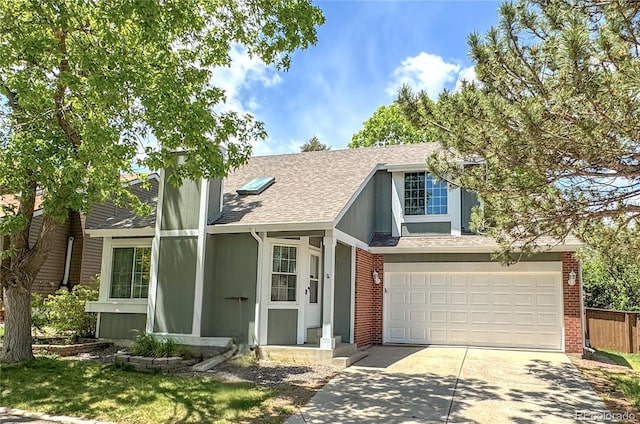 944 E Lily Ct, Highlands Ranch, CO 80126 - view of front of home featuring driveway, roof with shingles, an attached garage, and brick siding