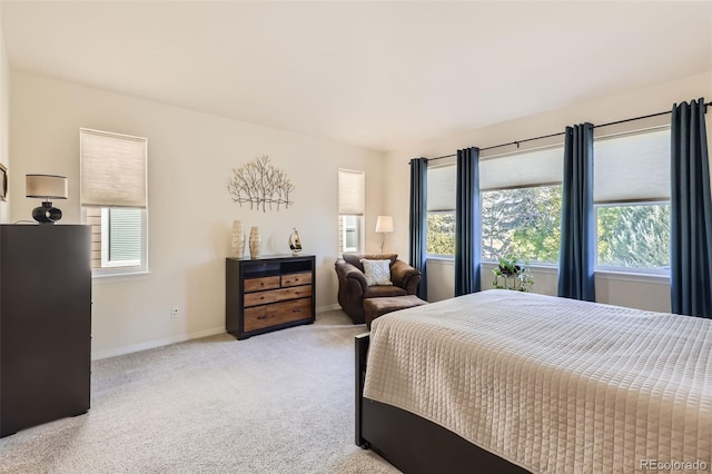 bedroom featuring light colored carpet