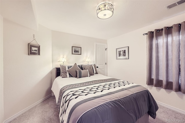 bedroom featuring light colored carpet