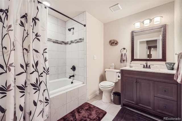 full bathroom featuring vanity, tile patterned flooring, toilet, and shower / bath combo