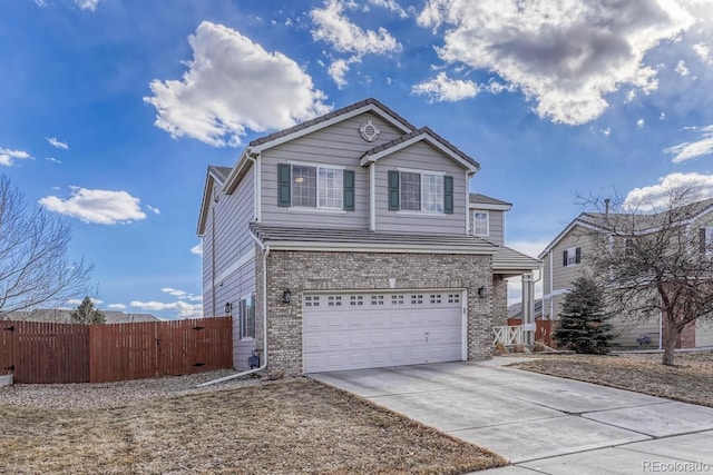 traditional home with a garage, brick siding, fence, and driveway