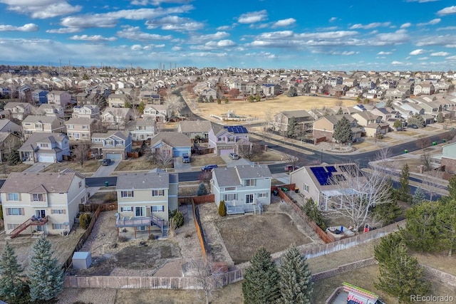 birds eye view of property with a residential view