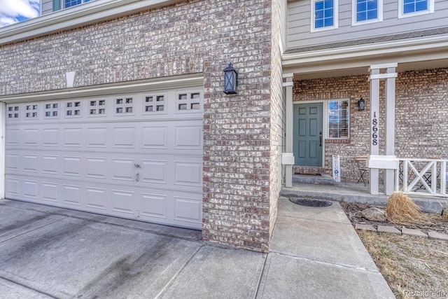 garage with concrete driveway