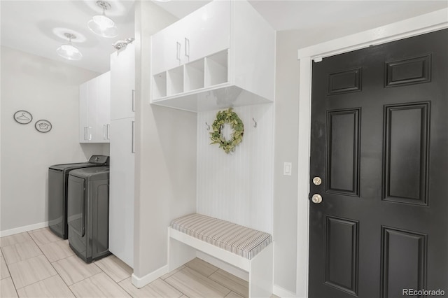 725 Nebula Ct, Colorado Springs, CO 80906 - mudroom with washing machine and clothes dryer and baseboards