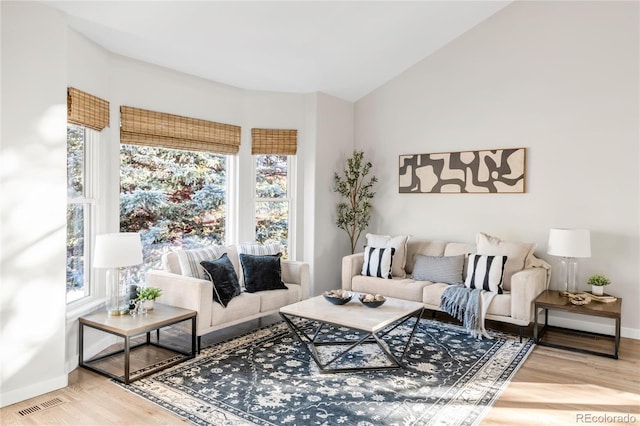 725 Nebula Ct, Colorado Springs, CO 80906 - living room with wood finished floors and vaulted ceiling