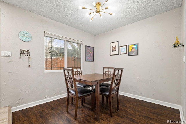 1060 S Parker Rd Unit 19, Denver, CO 80231 - dining room featuring a chandelier, baseboards, wood finished floors, and a textured ceiling