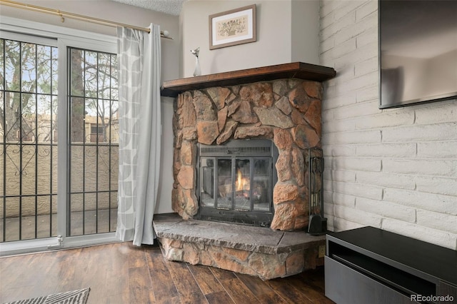1060 S Parker Rd Unit 19, Denver, CO 80231 - detailed view of wood finished floors and a fireplace