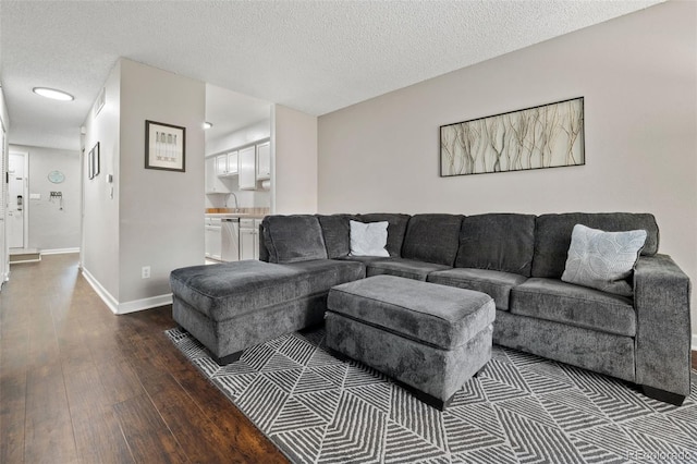 1060 S Parker Rd Unit 19, Denver, CO 80231 - living room with dark wood-style floors, baseboards, a textured ceiling, and recessed lighting
