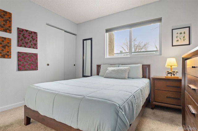 1060 S Parker Rd Unit 19, Denver, CO 80231 - carpeted bedroom with a closet and a textured ceiling