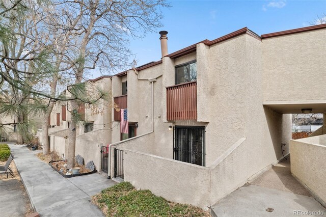1060 S Parker Rd Unit 19, Denver, CO 80231 - view of building exterior with fence