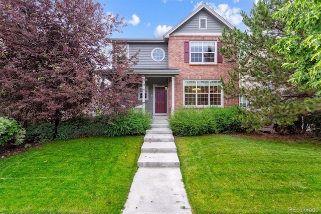 12427 James Ct, Broomfield, CO 80020 - traditional-style home with a front yard and brick siding