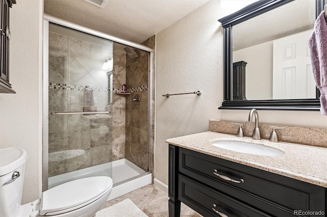 12427 James Ct, Broomfield, CO 80020 - full bathroom featuring a stall shower, vanity, tile patterned flooring, a textured ceiling, and a textured wall