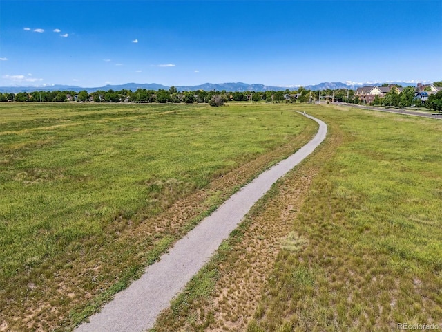 12427 James Ct, Broomfield, CO 80020 - view of property's community with a lawn and a mountain view