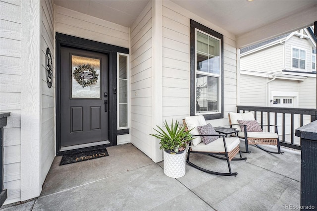 doorway to property featuring covered porch