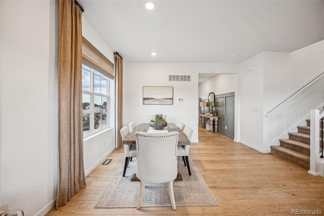 dining area with stairway, recessed lighting, visible vents, and light wood-style floors