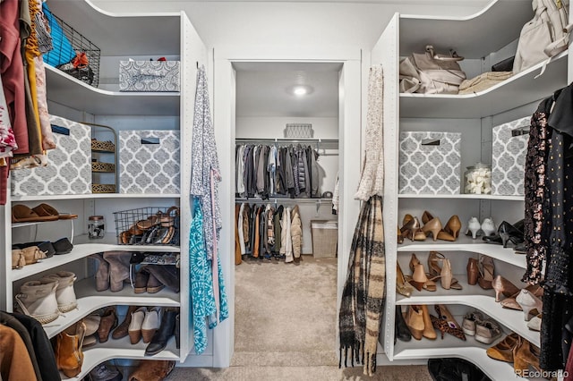 spacious closet with carpet flooring