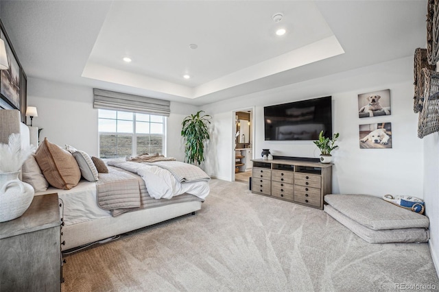 bedroom featuring carpet, a tray ceiling, and recessed lighting