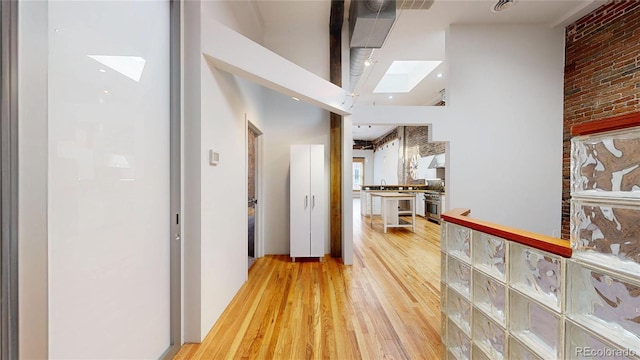 1510 Wazee St Unit 3, Denver, CO 80202 - hallway with a skylight and light wood-type flooring