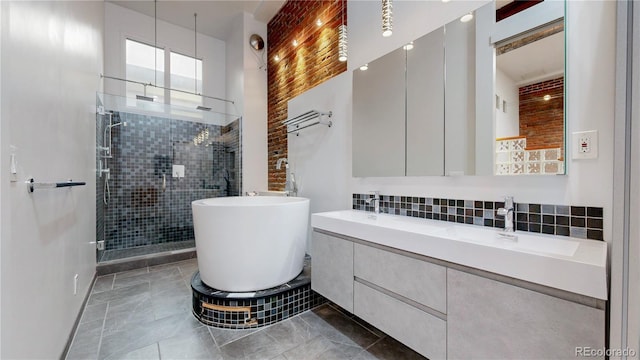 1510 Wazee St Unit 3, Denver, CO 80202 - full bathroom featuring a stall shower, tile patterned floors, a freestanding bath, double vanity, and decorative backsplash