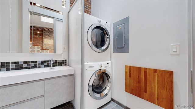 1510 Wazee St Unit 3, Denver, CO 80202 - laundry room with estacked washer and dryer and electric panel