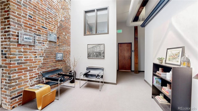 1510 Wazee St Unit 3, Denver, CO 80202 - sitting room with carpet, baseboards, and a towering ceiling