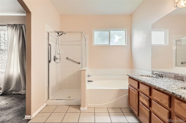 2307 S Ensenada St, Aurora, CO 80013 - bathroom featuring plenty of natural light, a shower stall, and a garden tub