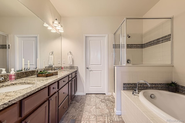 504 E Dry Creek Pl, Littleton, CO 80122 - bathroom with a stall shower, double vanity, a bath, and baseboards